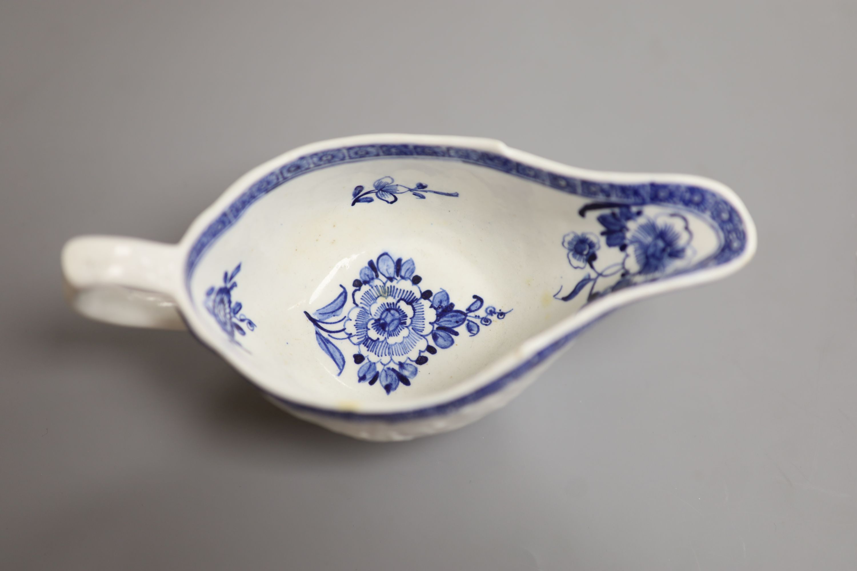 A Derby sauceboat, with flowers, c.1765, patch marks, length 17cm